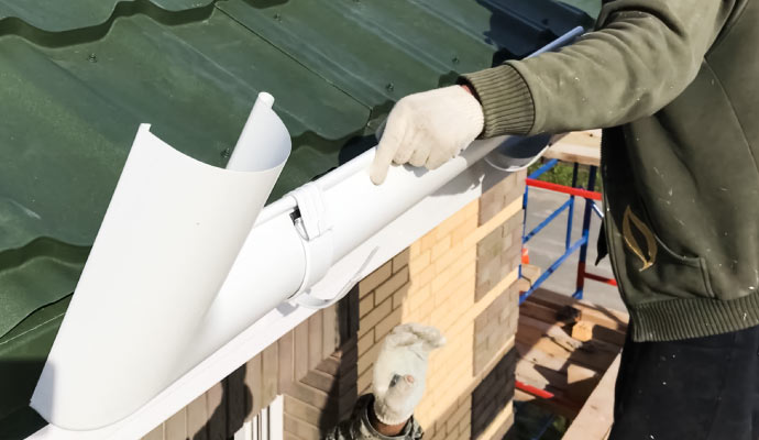 Expert installing gutters.