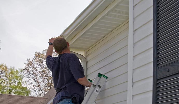 Expert installing gutter.