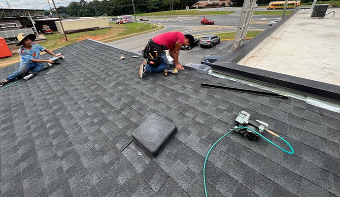 Expert installing commercial roof.