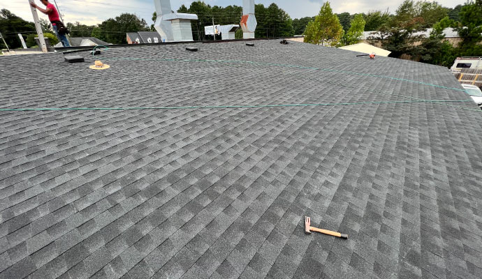 Expert working on industrial roof.