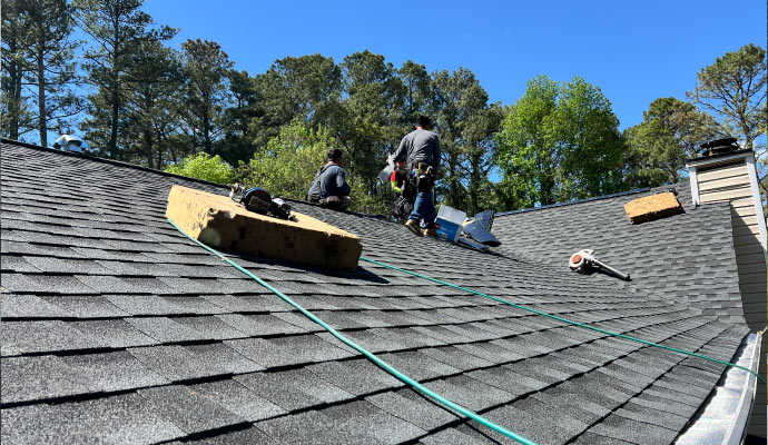 Expert installing roof using equipment.