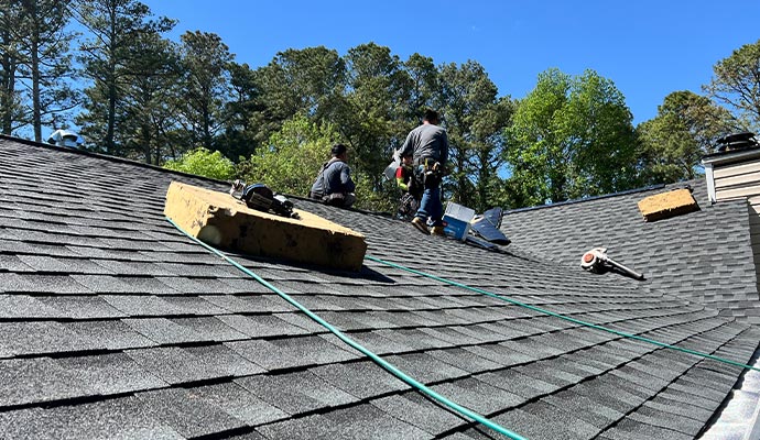 Professional inspecting roof.